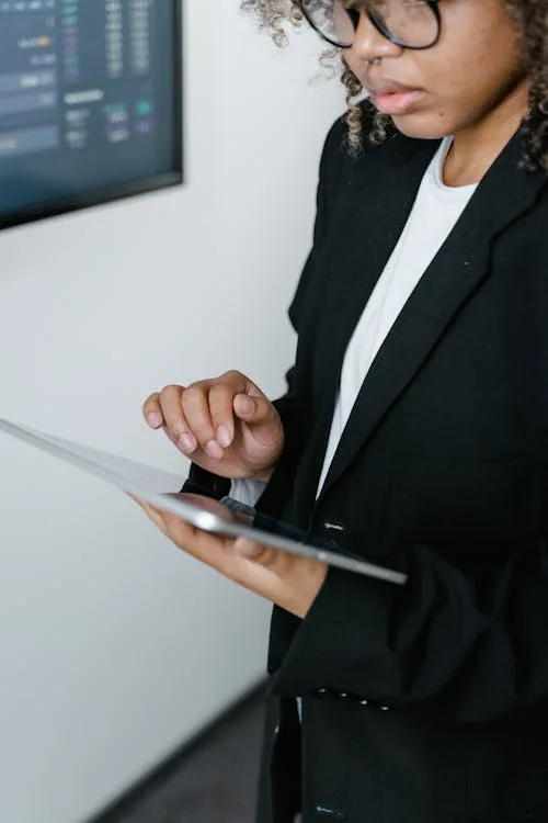 Woman using tablet crypto screen - pre-reveal lazy mint NFT